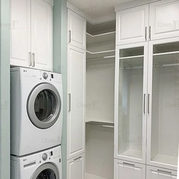 An image of a Walk In Closet with Glass Fronts & Laundry - Oxford White